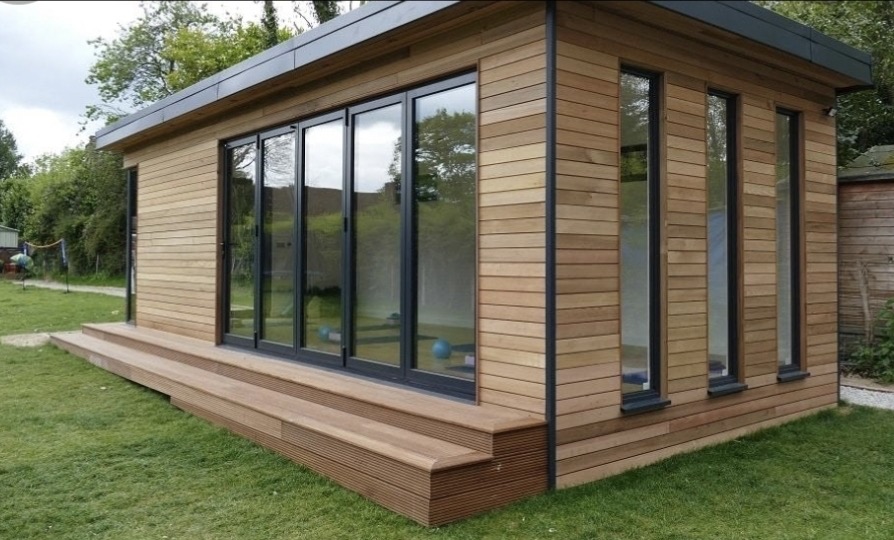 Cedar-clad garden room with hardwood decking